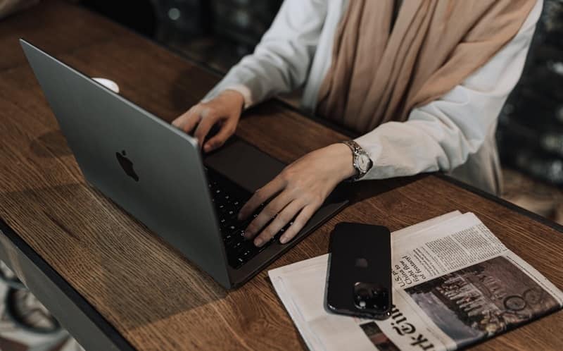 Woman working on a Macbook