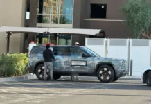 Rivian R2 Spotted Charging at Tesla Supercharger, Revealing Built-In NACS Port for 2026 Debut Rivian R2